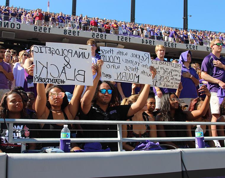 A group of TCU students participated in a silent demonstration during the National Anthem.